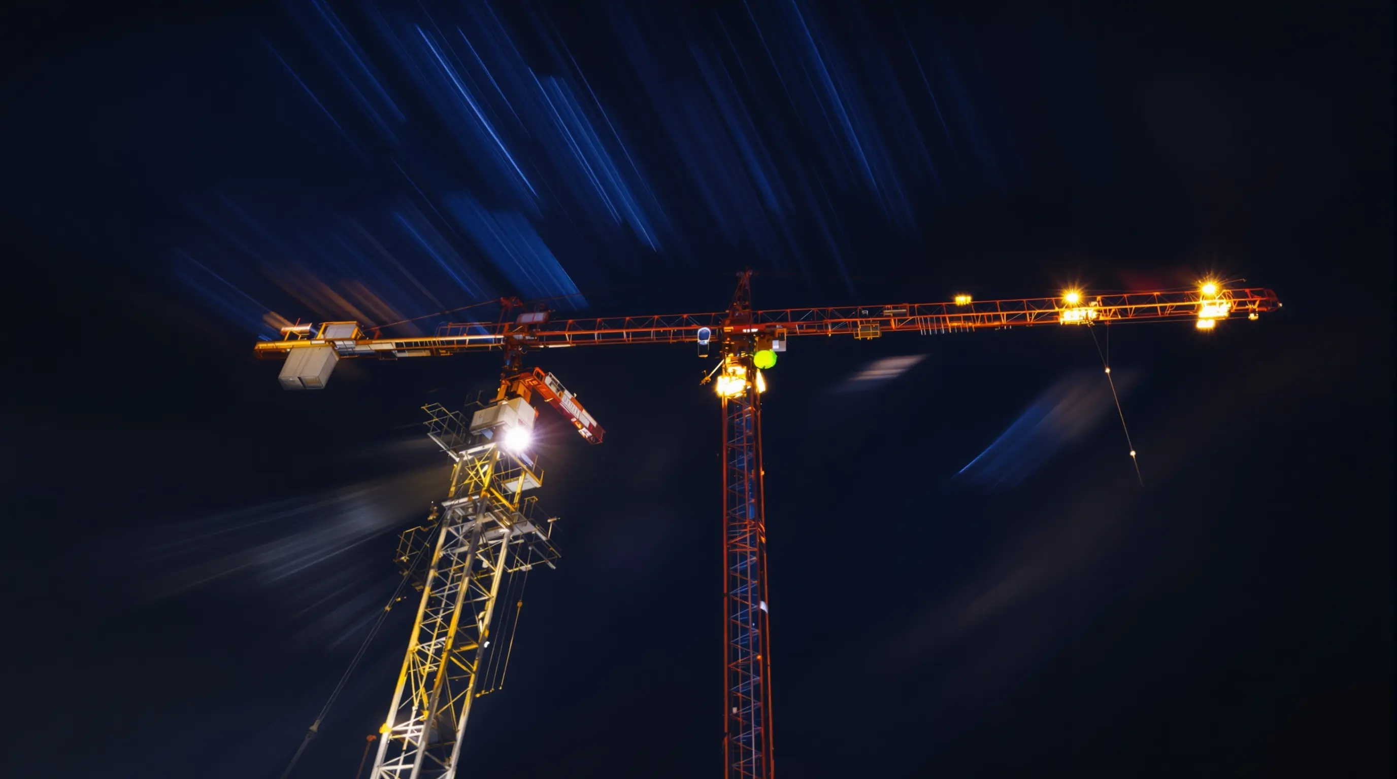 Construction crane in motion at night representing speed