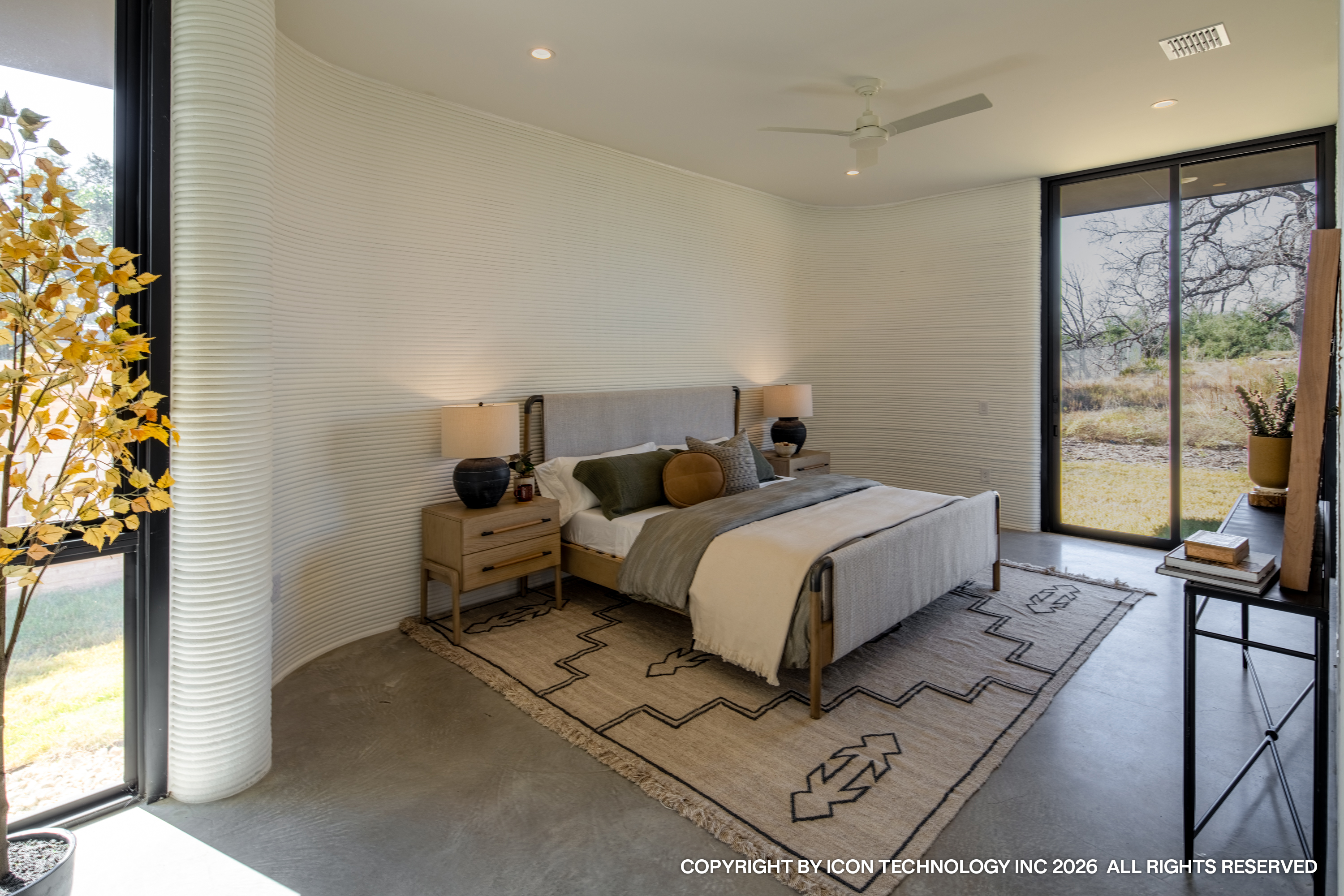 Finished 3D printed concrete home at 22 Peace Pipe, Wolf Ranch, front elevation with landscaping